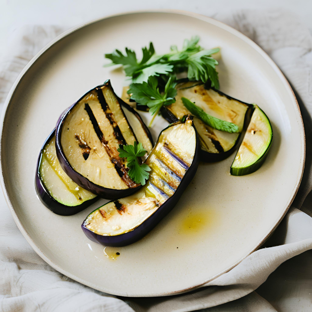 Grilled eggplant and zucchini slices, drizzled with olive oil and garnished with fresh parsley, highlight the simplicity and flavor of Mediterranean cooking