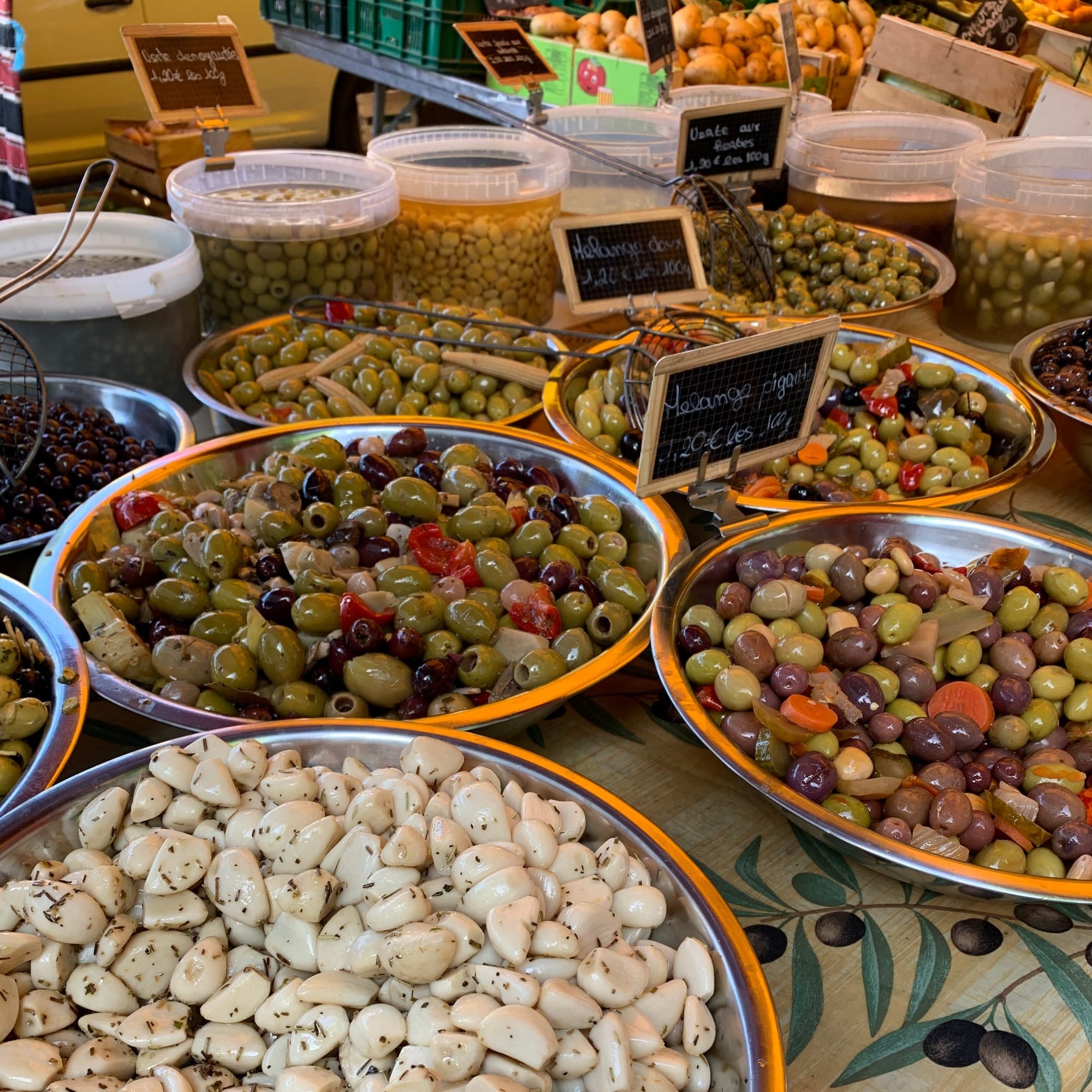Market stand in Port Grimaud with local products like olives and herb garlic