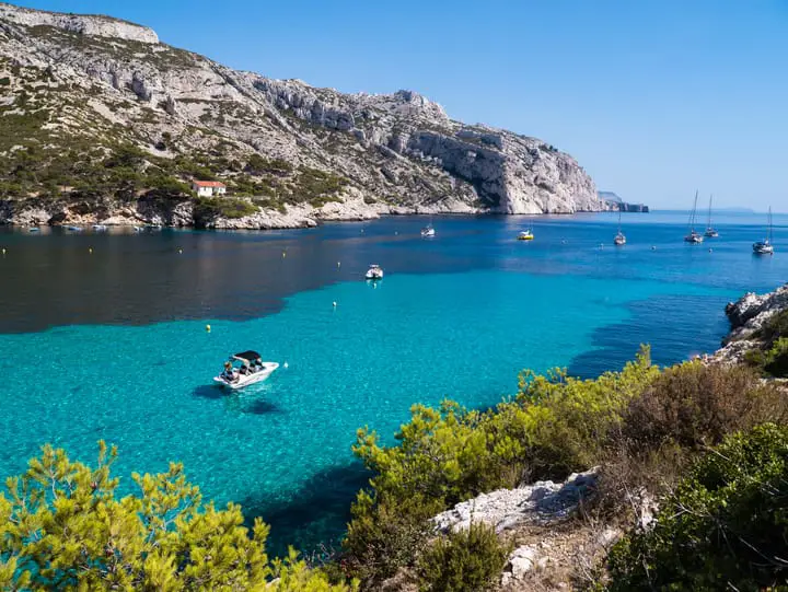 pristine turquoise waters and dramatic limestone cliffs of the Calanques